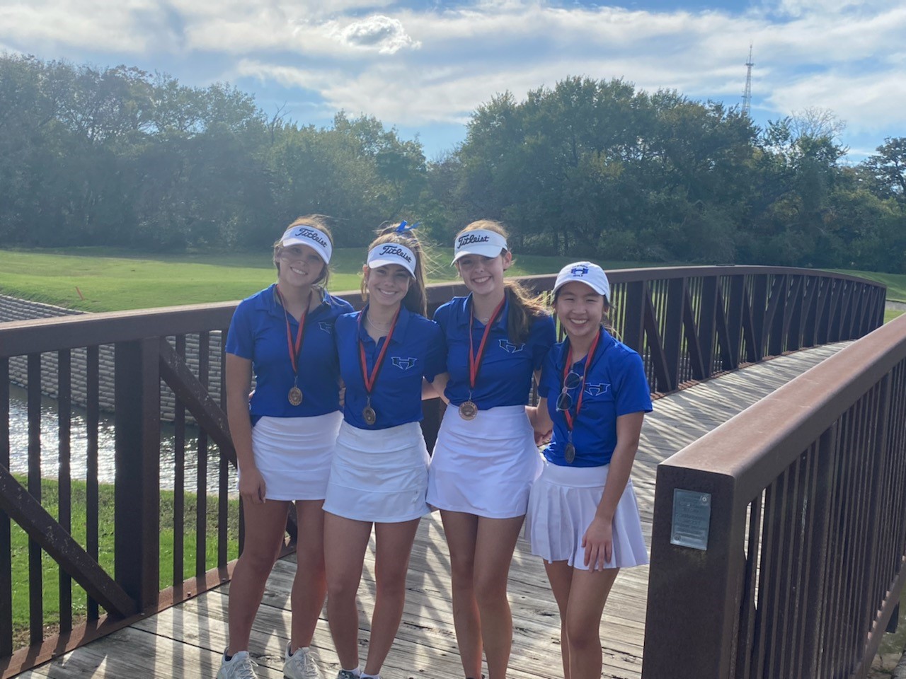 Four Girls in Blue and White With Medals