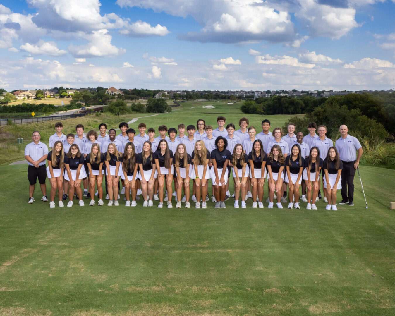 Group photo of boys and girls in a golf course