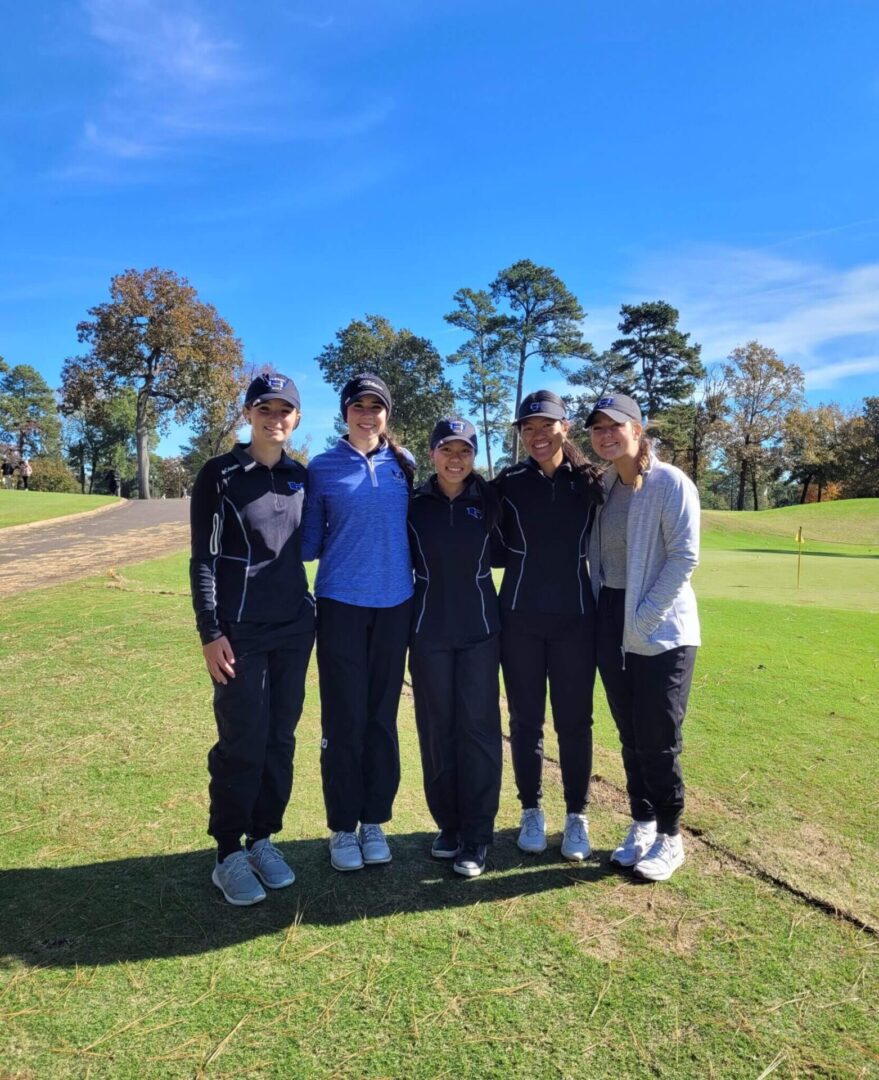 A Group of Women Standing on a Golf Course
